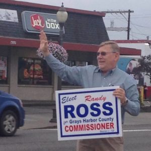 Randy Ross, the candidate running against Frank Gordon is holding the one campaign sign Commissioner Gordon can't take